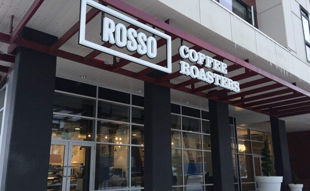 Coffee shop exterior with signage.